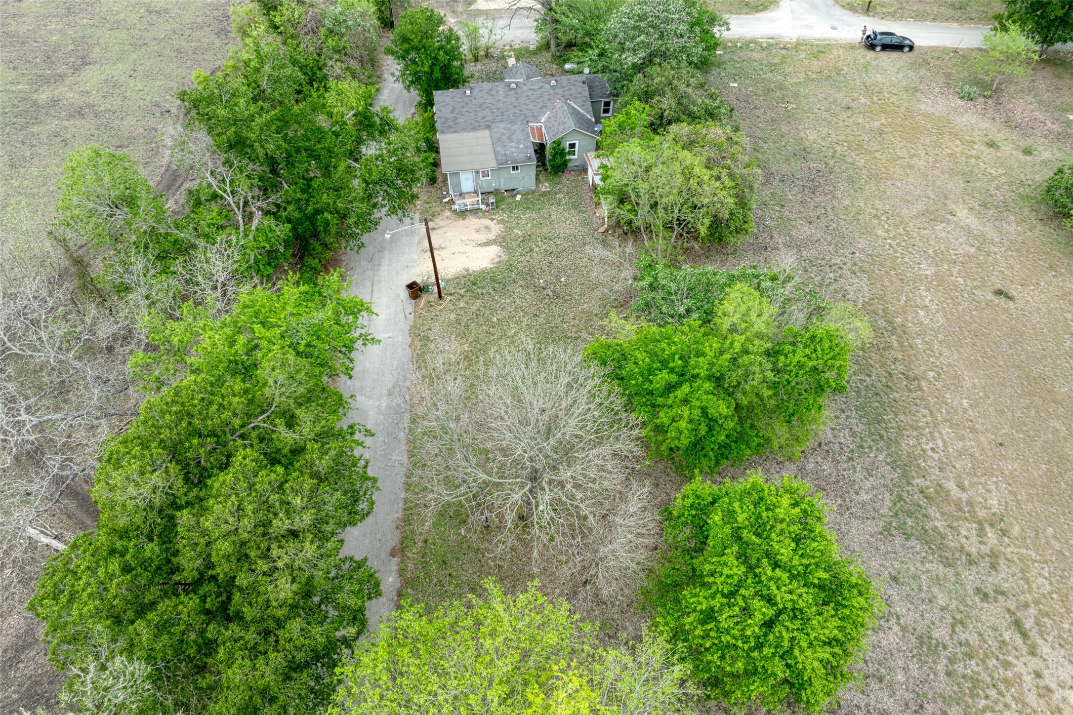 1006 Proctor Street Lockhart, TX 78644 - Photo 16 of 24 an aerial view of a house with a yard