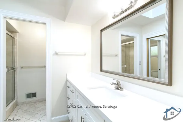 a bathroom with a bathtub and a sink