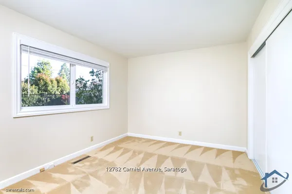 a view of a room with a window