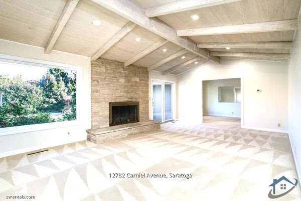a view of livingroom with an empty space and window
