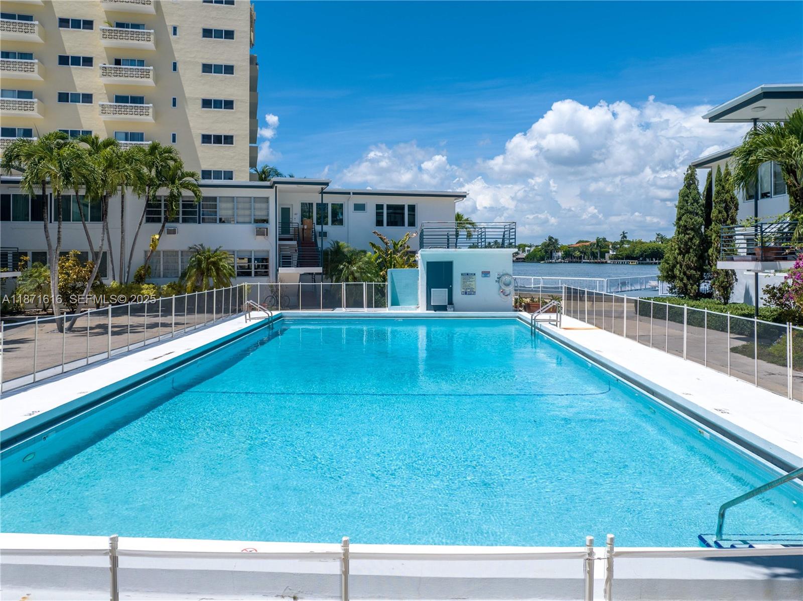 4710 Pine Tree Drive, Unit 26 Miami Beach, FL 33140 - Photo 20 of 20 a view of a swimming pool with a patio