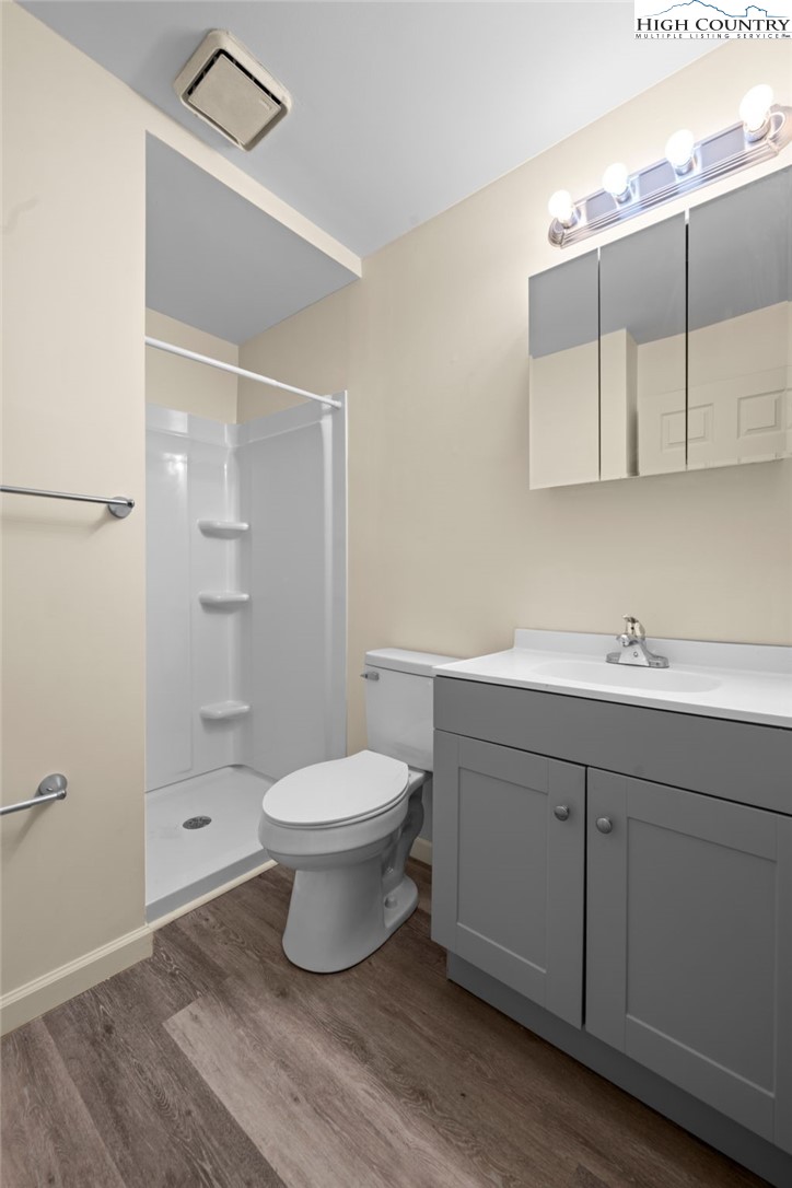 128 Zeb Street, Unit A101 Boone, NC 28607 - Photo 20 of 32 a bathroom with a toilet sink and shower