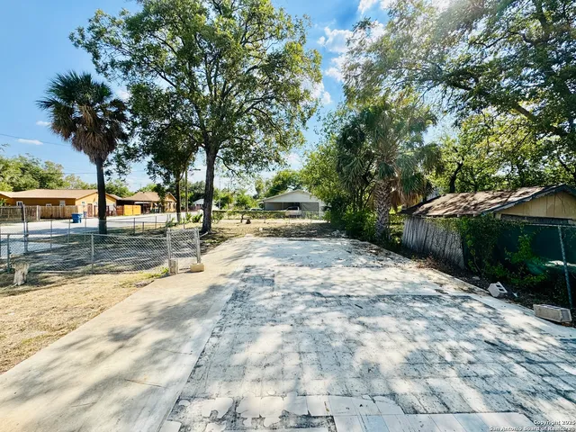 a view of a water fountain in front of a house