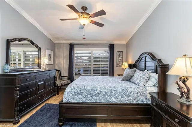 a bedroom with a bed and a dresser with the dresser