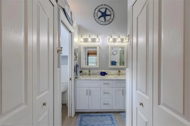 a bathroom with a light fixture and a sink