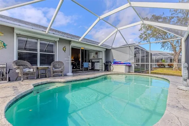 a view of a swimming pool with sitting area