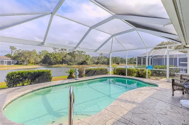 a view of a swimming pool with a patio