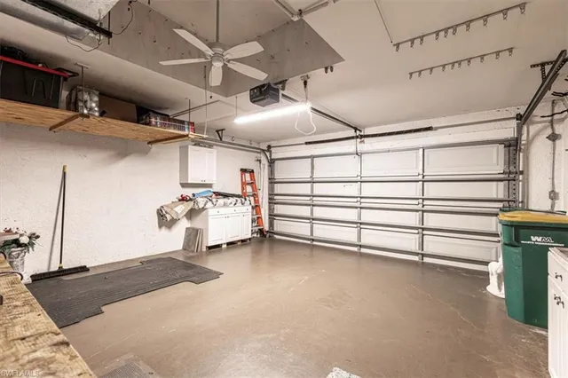 an aerial view of a house with yard swimming pool and outdoor seating