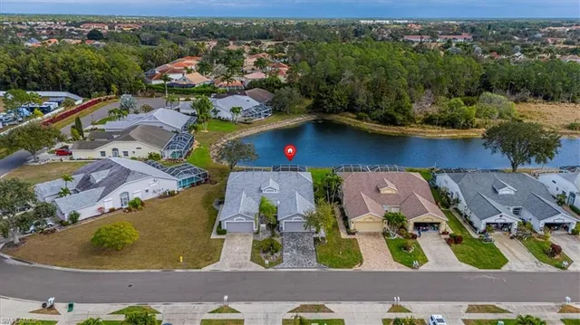 an aerial view of residential house with outdoor space and swimming pool