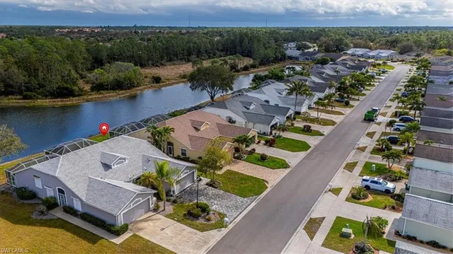 an aerial view of a house with a lake view