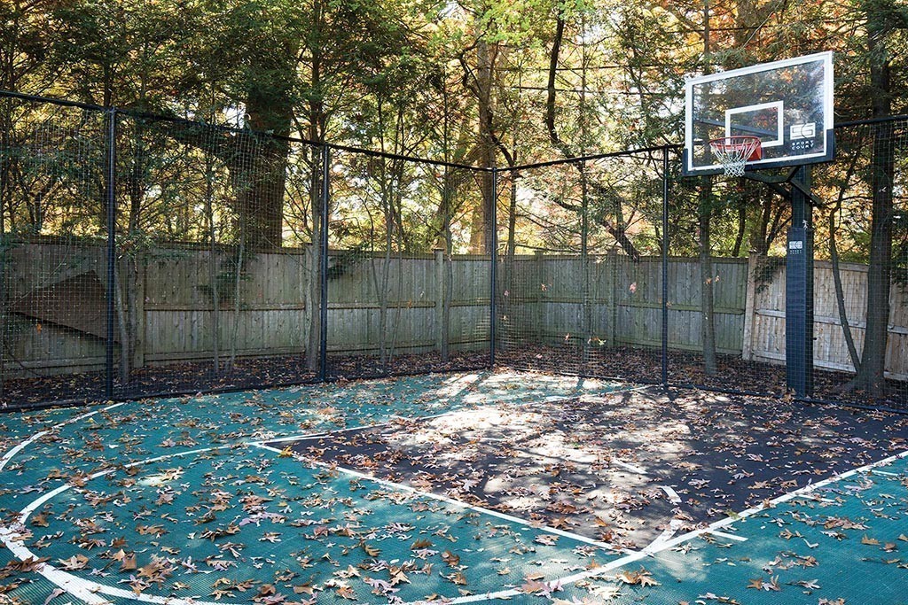 181 Laurel Road Brookline, MA 02467 - Photo 18 of 19 a backyard of a house