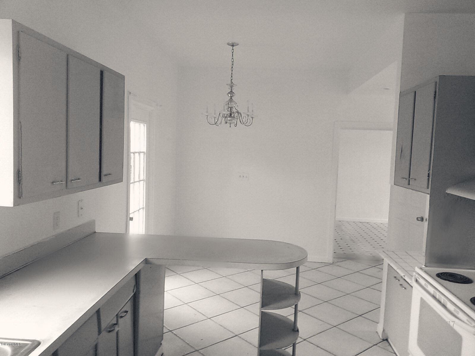 1166 Cable Lane Northeast, Unit 32905 Palm Bay, FL 32905 - Photo 3 of 3 living room kitchen for mls
