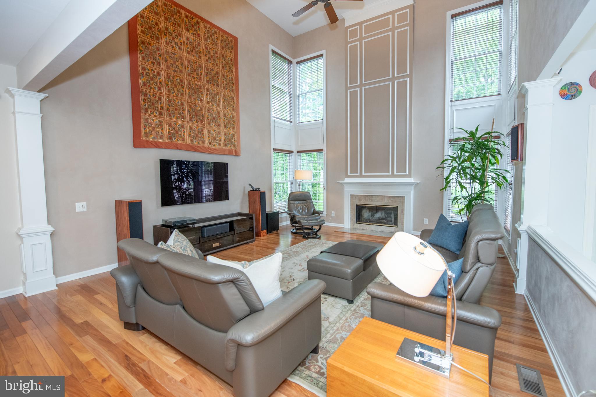 32 Eagleton Farm Road Newtown, PA 18940 - Photo 11 of 39 a living room with furniture a fireplace and a potted plant