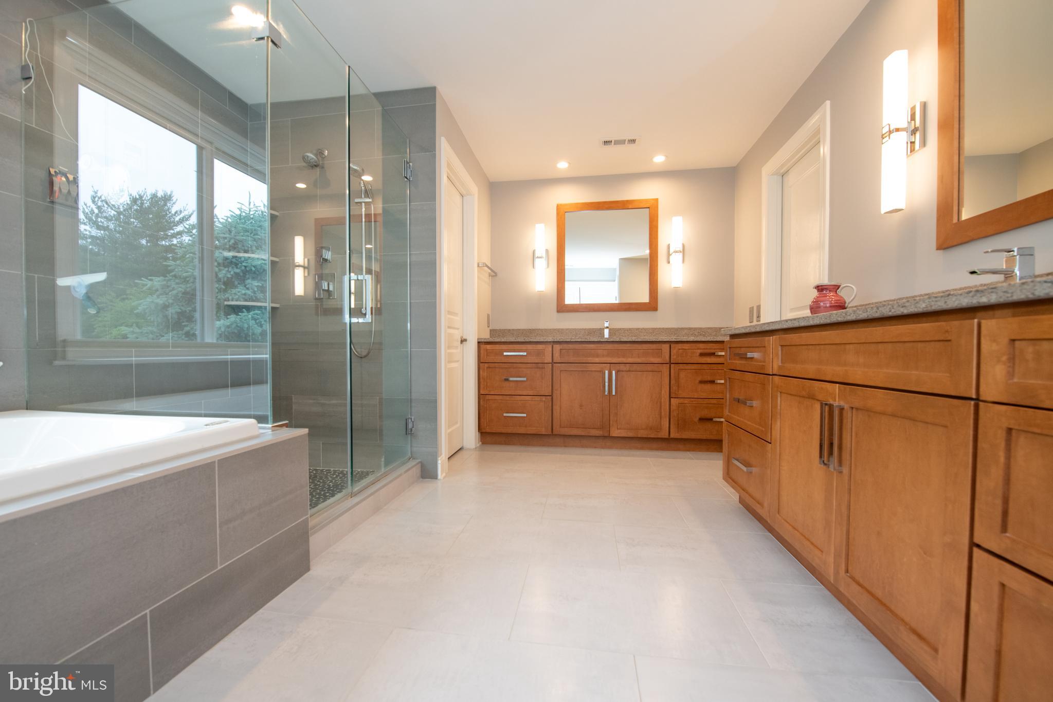 32 Eagleton Farm Road Newtown, PA 18940 - Photo 20 of 39 a large bathroom with a large tub and shower