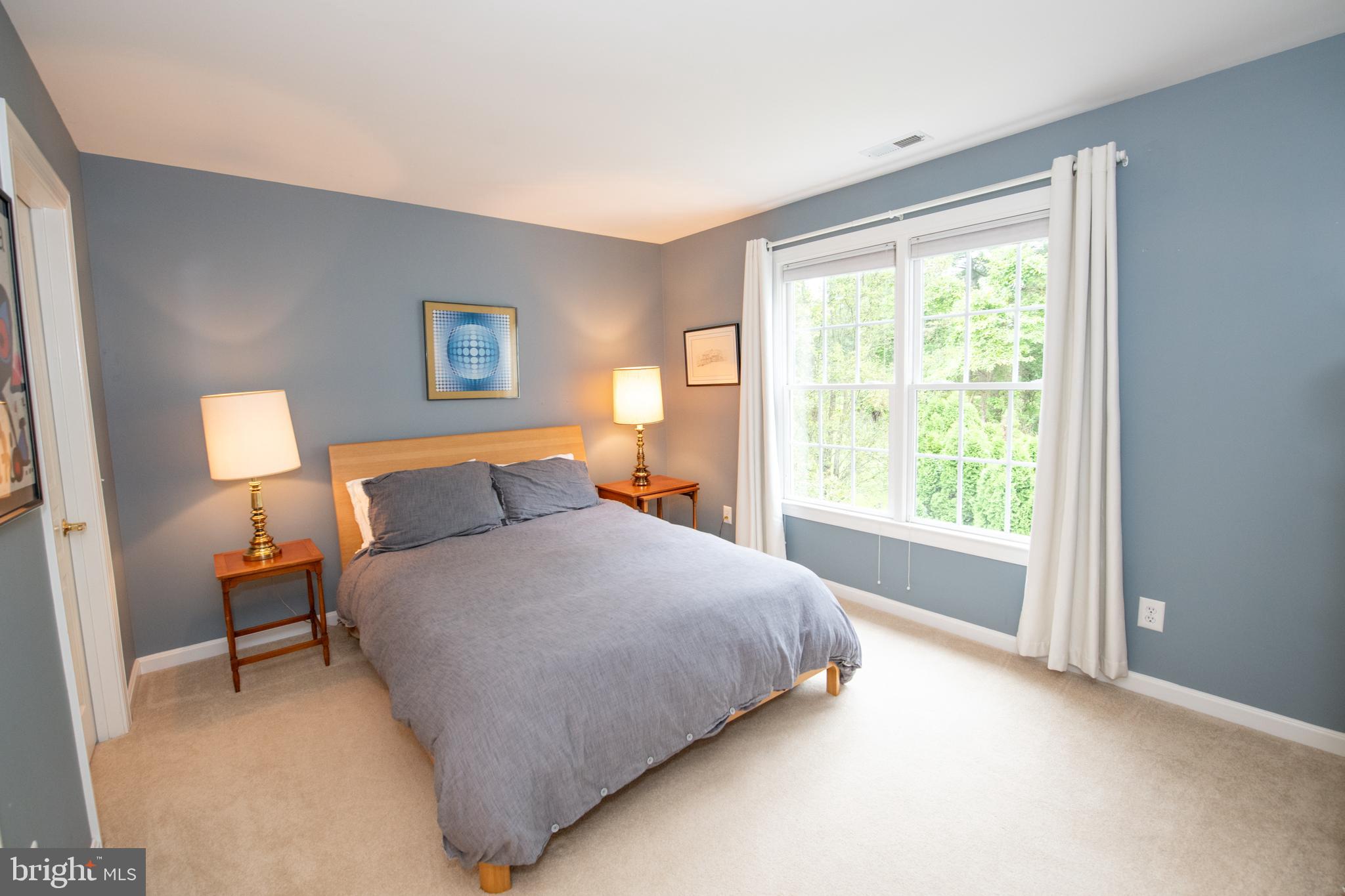 32 Eagleton Farm Road Newtown, PA 18940 - Photo 22 of 39 a bedroom with a bed and lamp next to a window