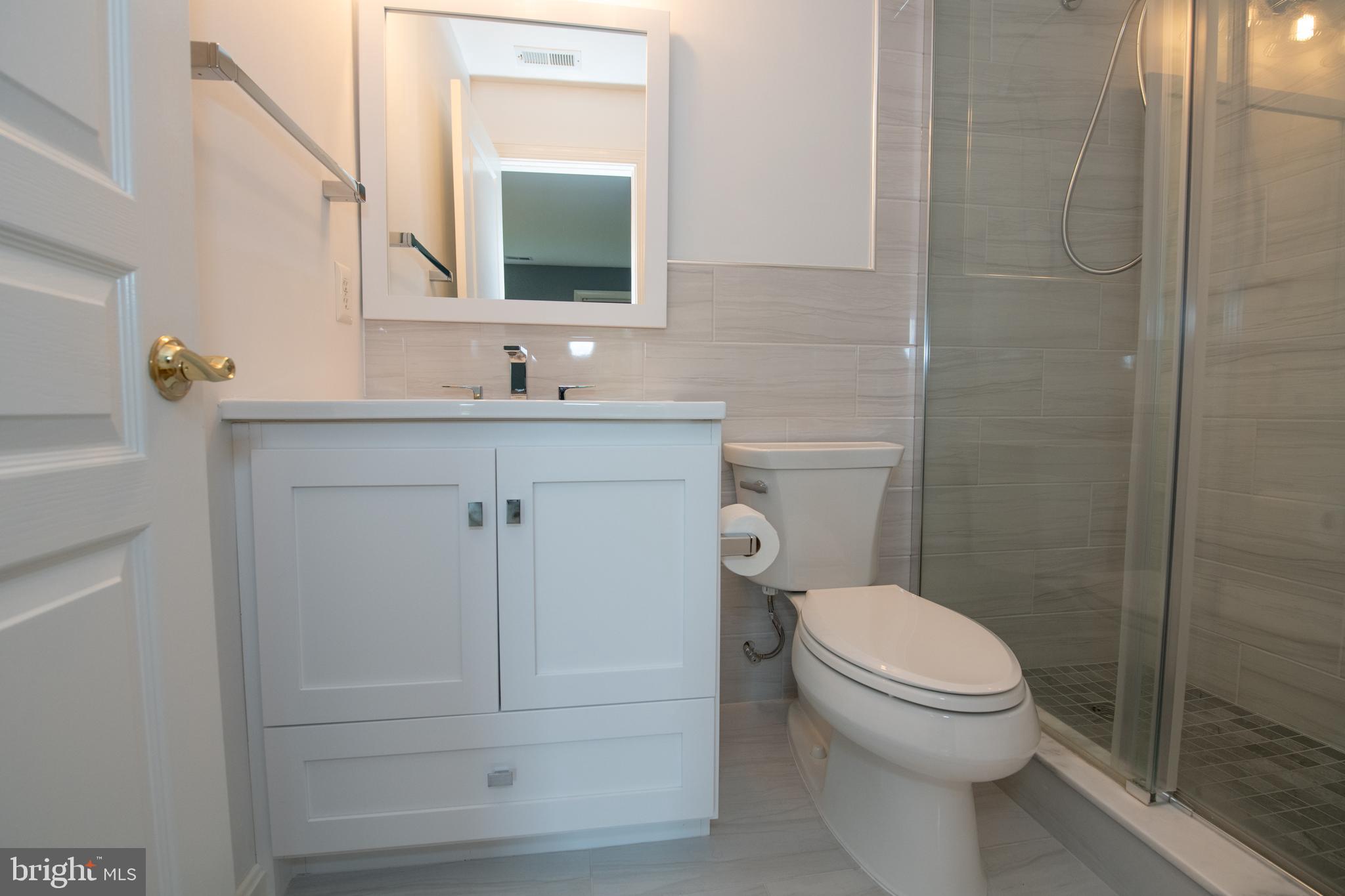 32 Eagleton Farm Road Newtown, PA 18940 - Photo 26 of 39 a bathroom with a sink a toilet and mirror