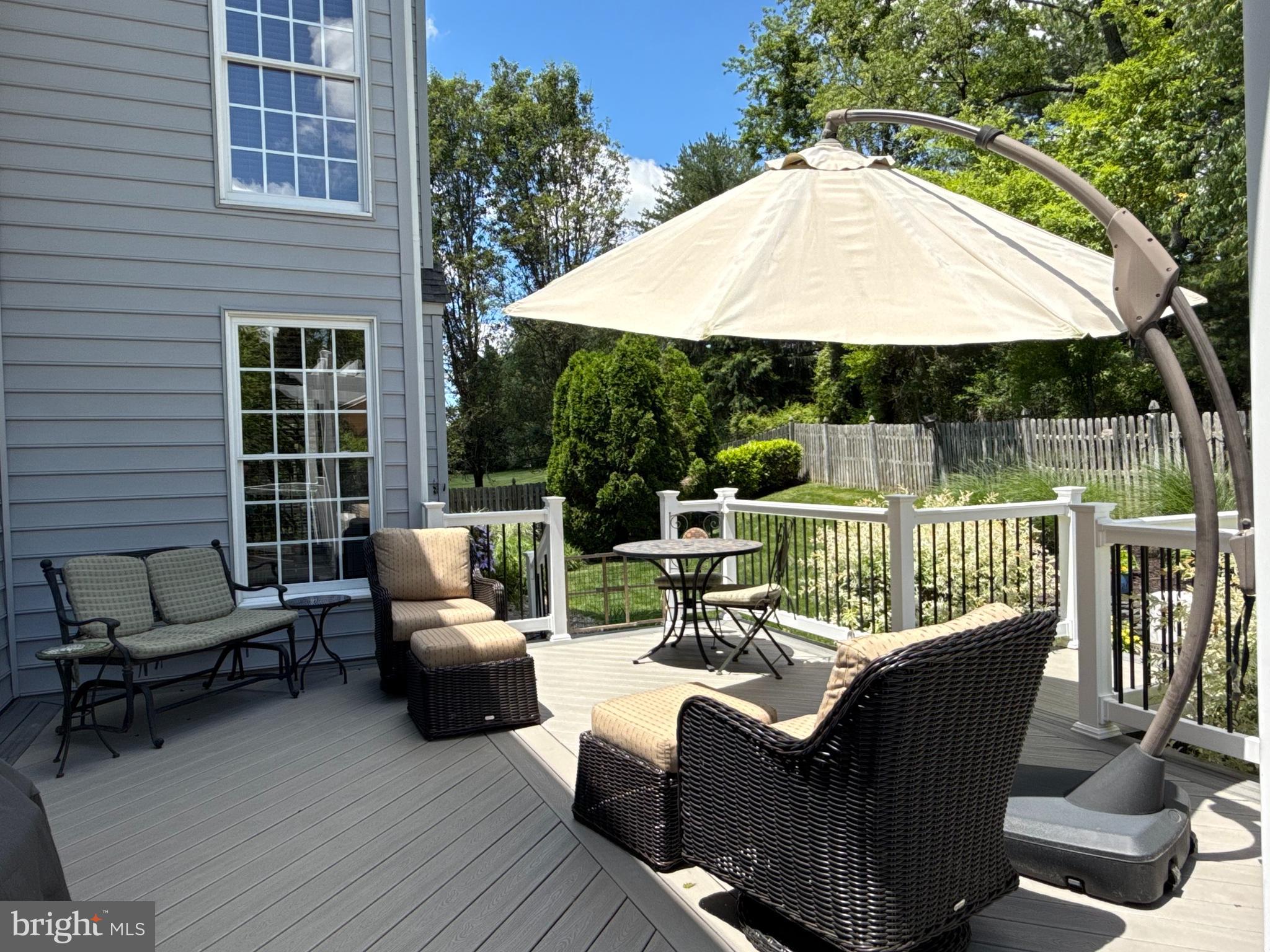 32 Eagleton Farm Road Newtown, PA 18940 - Photo 32 of 39 a view of a patio with couches chairs potted plants and a small yard