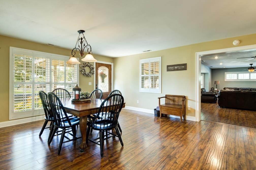 1300 Main Street Decatur, TN 37322 - Photo 7 of 31 a view of a dining room with furniture window and wooden floor