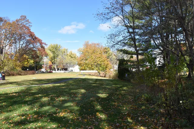a view of a house with a yard porch and sitting area