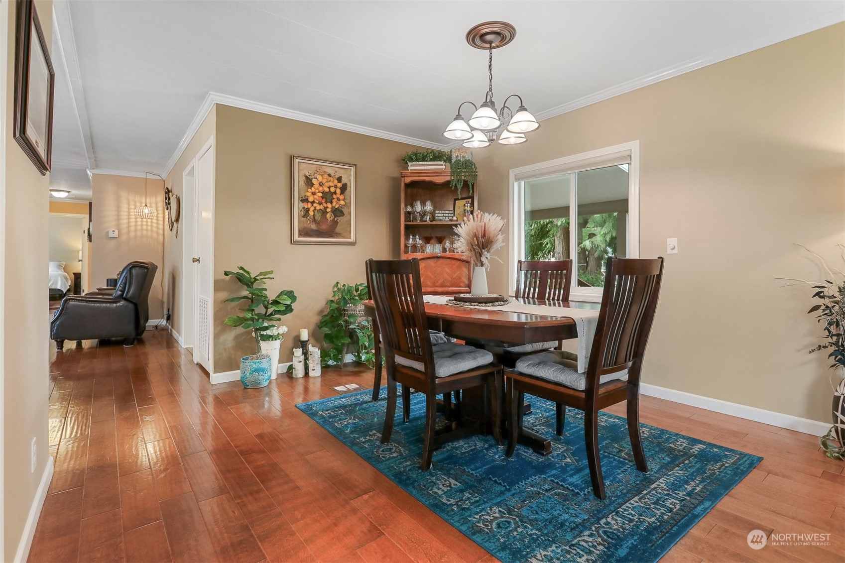 23817 Willow Circle Bothell, WA 98021 - Photo 8 of 39 a view of a dining room with furniture a chandelier and wooden floor
