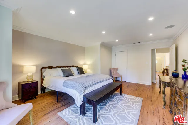 a bed room with a bed and a table