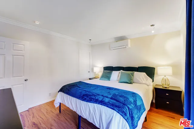 a bedroom with a bed and a lamp