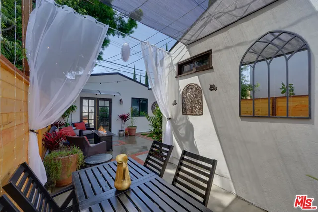 a front view of a house with outdoor seating