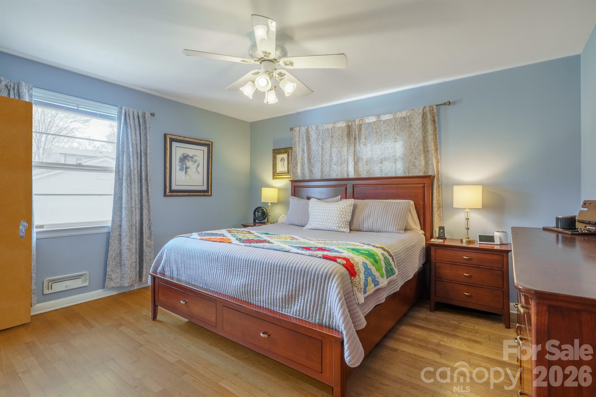 712 2nd Avenue Northwest Conover, NC 28613 - Photo 18 of 33 a bedroom with a bed and a chandelier