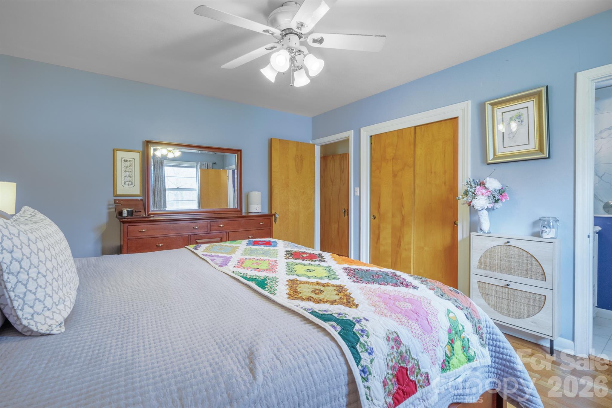 712 2nd Avenue Northwest Conover, NC 28613 - Photo 19 of 33 a bedroom with a bed and a chandelier