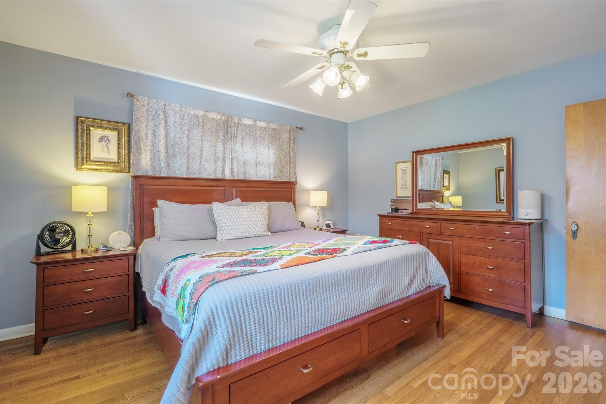 712 2nd Avenue Northwest Conover, NC 28613 - Photo 20 of 33 a bedroom with a bed and a chandelier