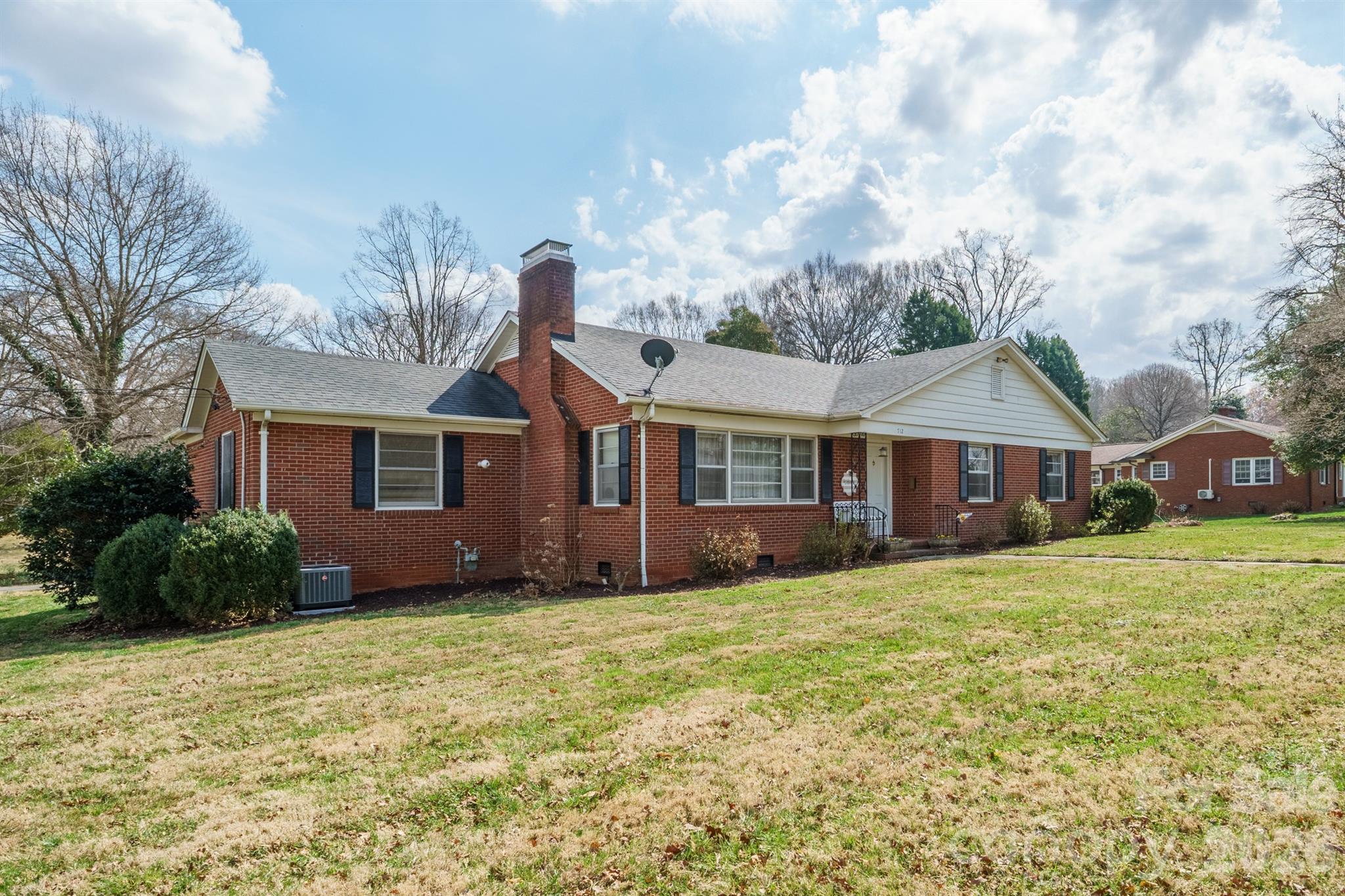 712 2nd Avenue Northwest Conover, NC 28613 - Photo 2 of 33 a front view of a house with a garden