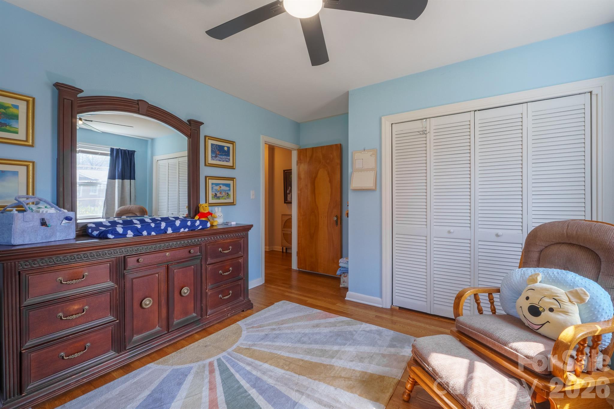 712 2nd Avenue Northwest Conover, NC 28613 - Photo 26 of 33 a bedroom with a bed and wooden floor