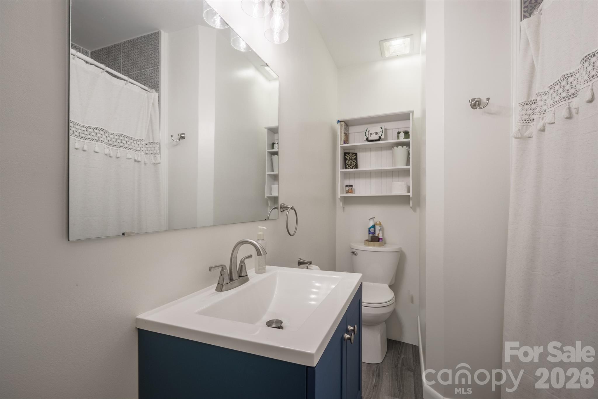 712 2nd Avenue Northwest Conover, NC 28613 - Photo 27 of 33 a bathroom with a sink a toilet and shower