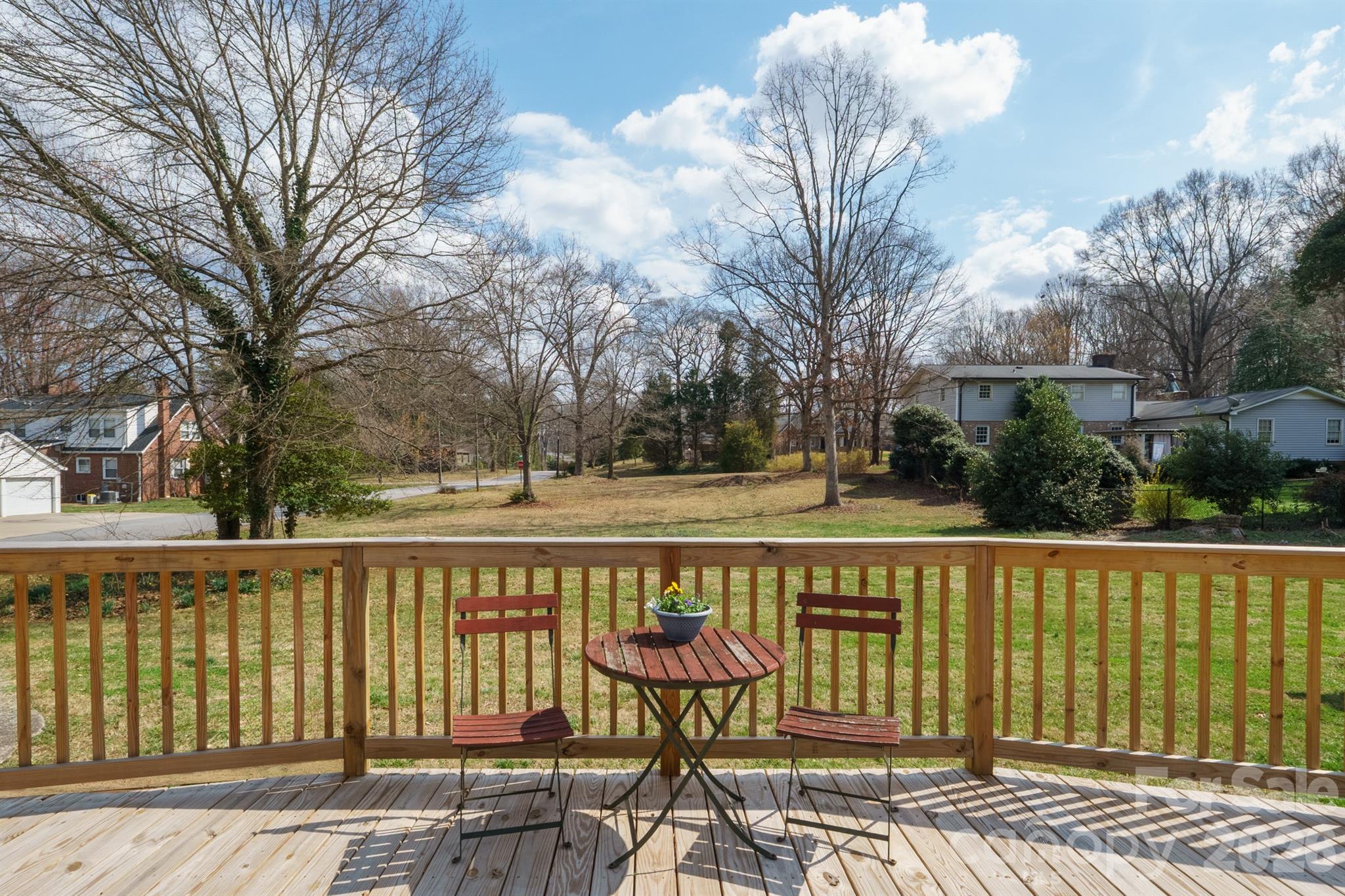 712 2nd Avenue Northwest Conover, NC 28613 - Photo 28 of 33 a view of a street with a bench and trees