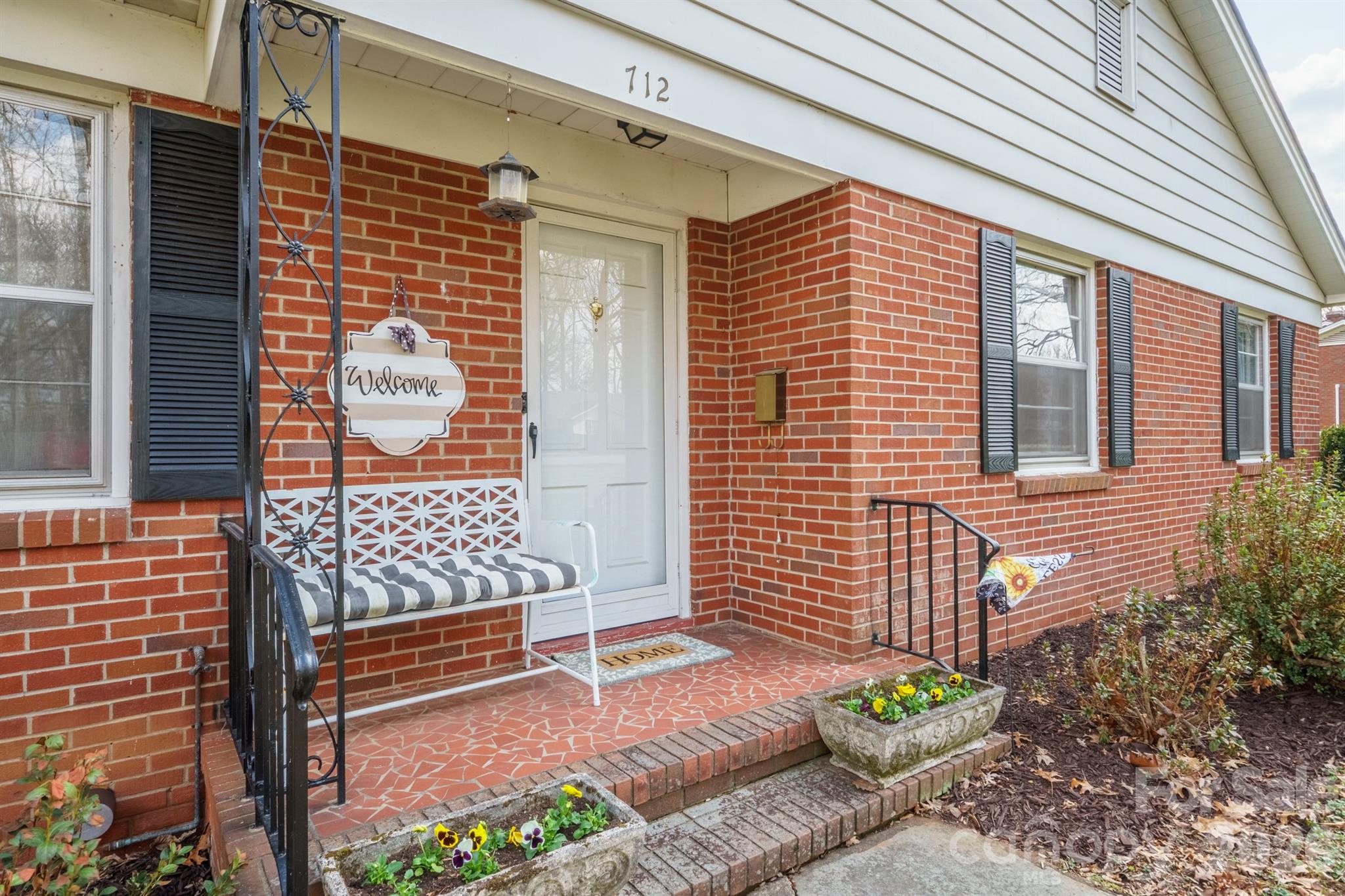 712 2nd Avenue Northwest Conover, NC 28613 - Photo 4 of 33 a view of a brick wall with an outdoor space