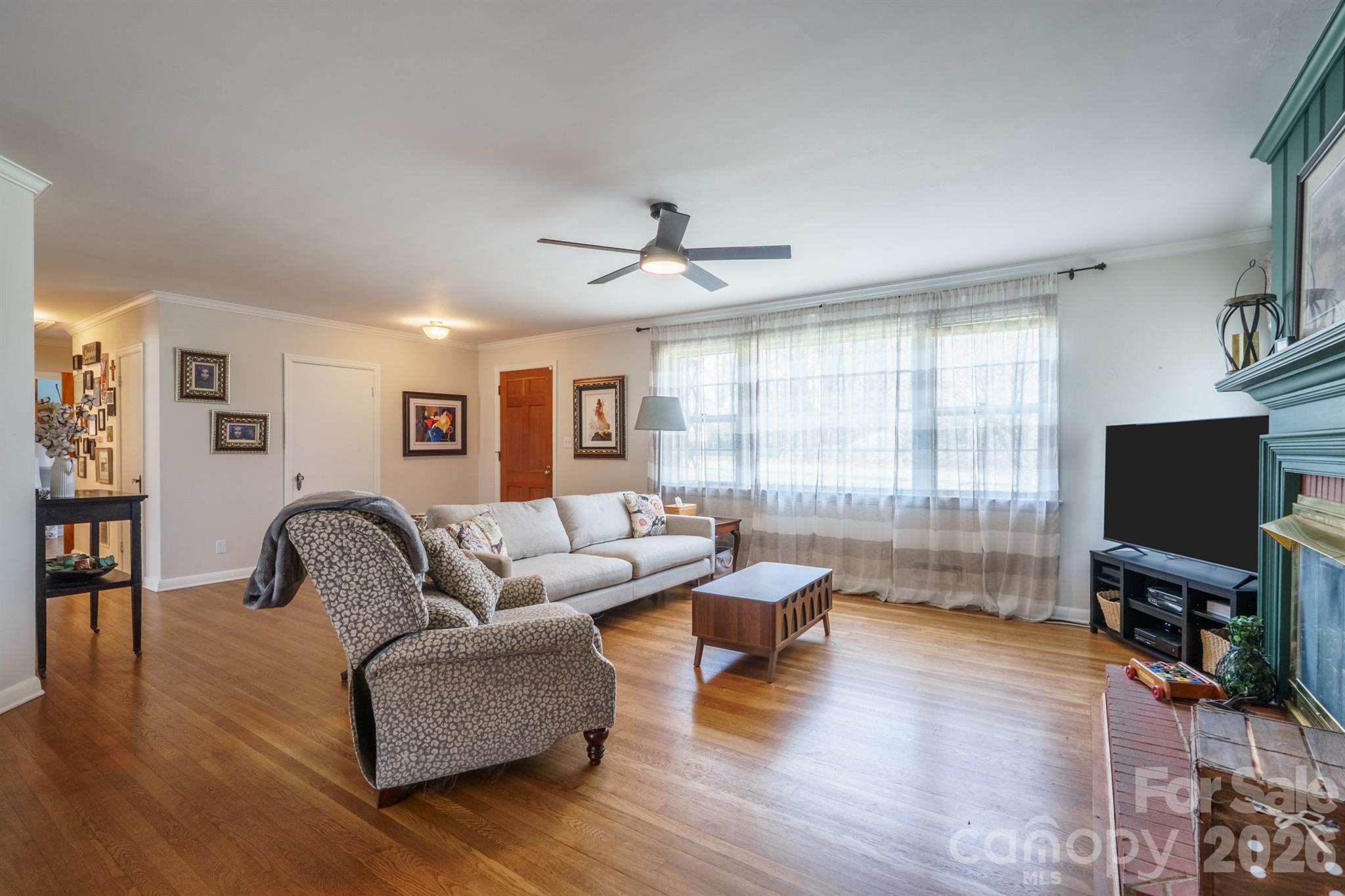 712 2nd Avenue Northwest Conover, NC 28613 - Photo 6 of 33 a living room with furniture and a flat screen tv