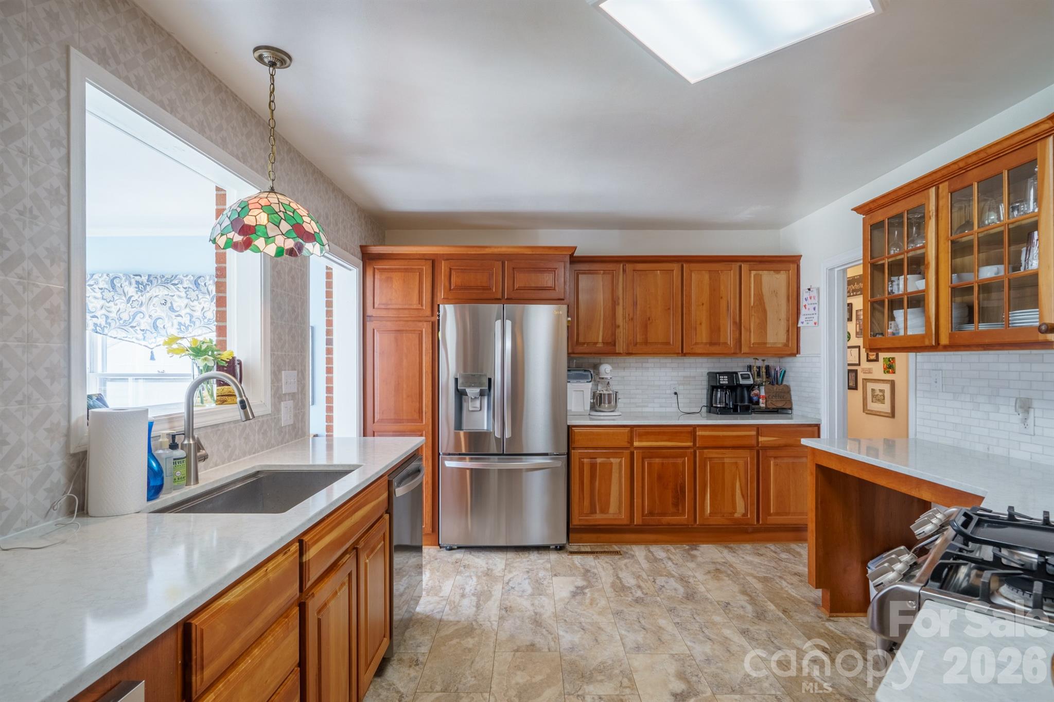 712 2nd Avenue Northwest Conover, NC 28613 - Photo 10 of 33 a kitchen with stainless steel appliances granite countertop a sink stove and refrigerator
