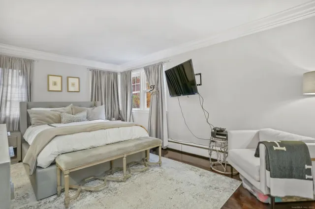 a kitchen with stainless steel appliances granite countertop a sink stove and white cabinets