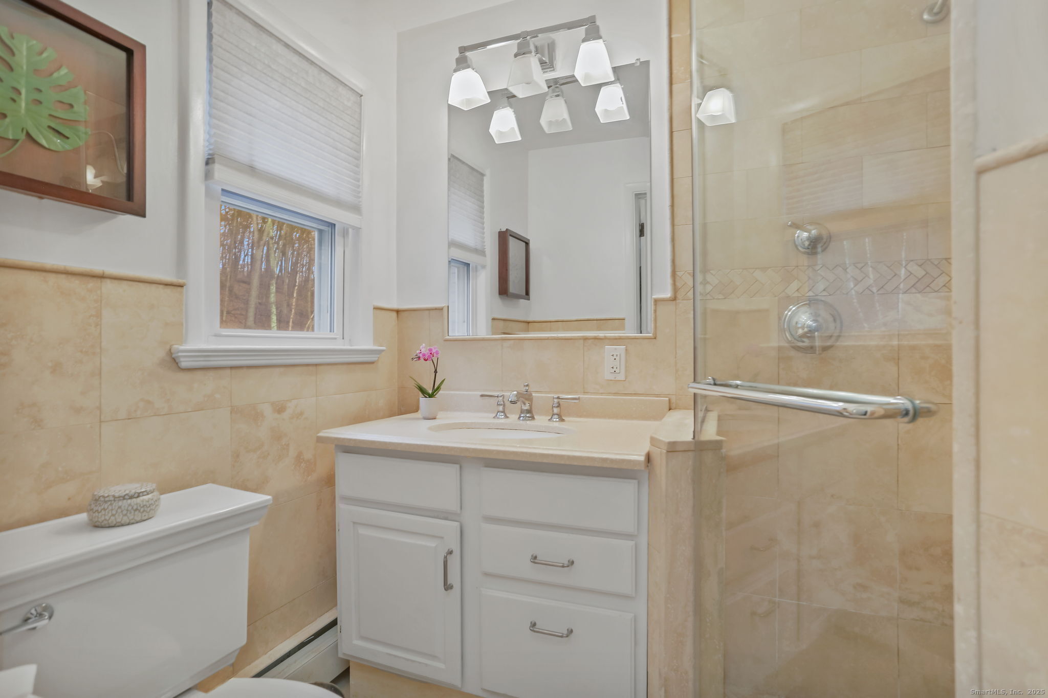 24 Warnock Drive Westport, CT 06880 - Photo 13 of 31 a bathroom with a sink a toilet and a mirror