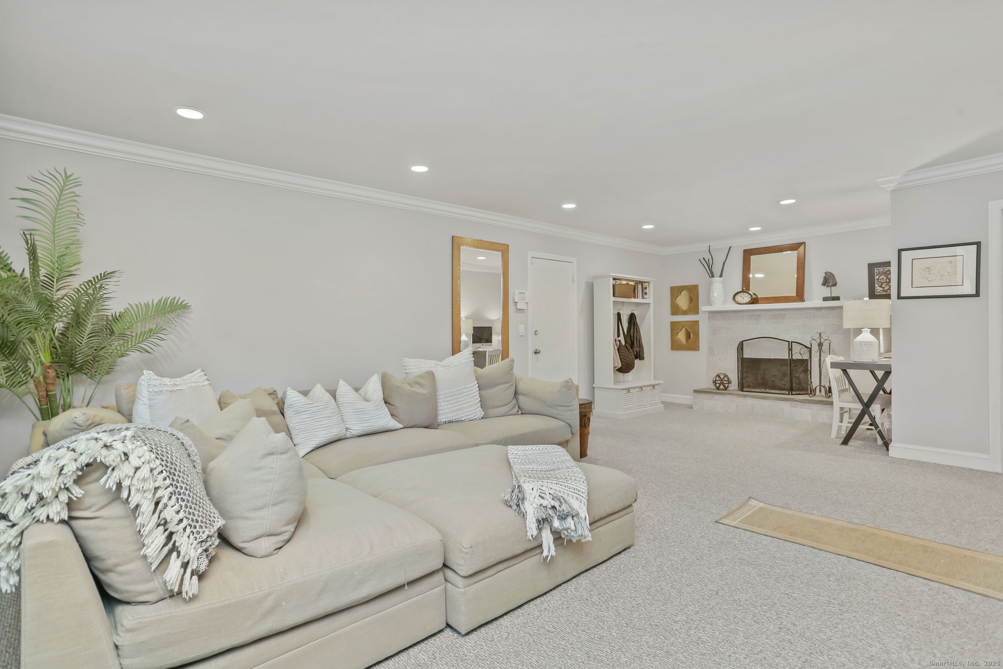 24 Warnock Drive Westport, CT 06880 - Photo 17 of 31 a living room with furniture and a fireplace