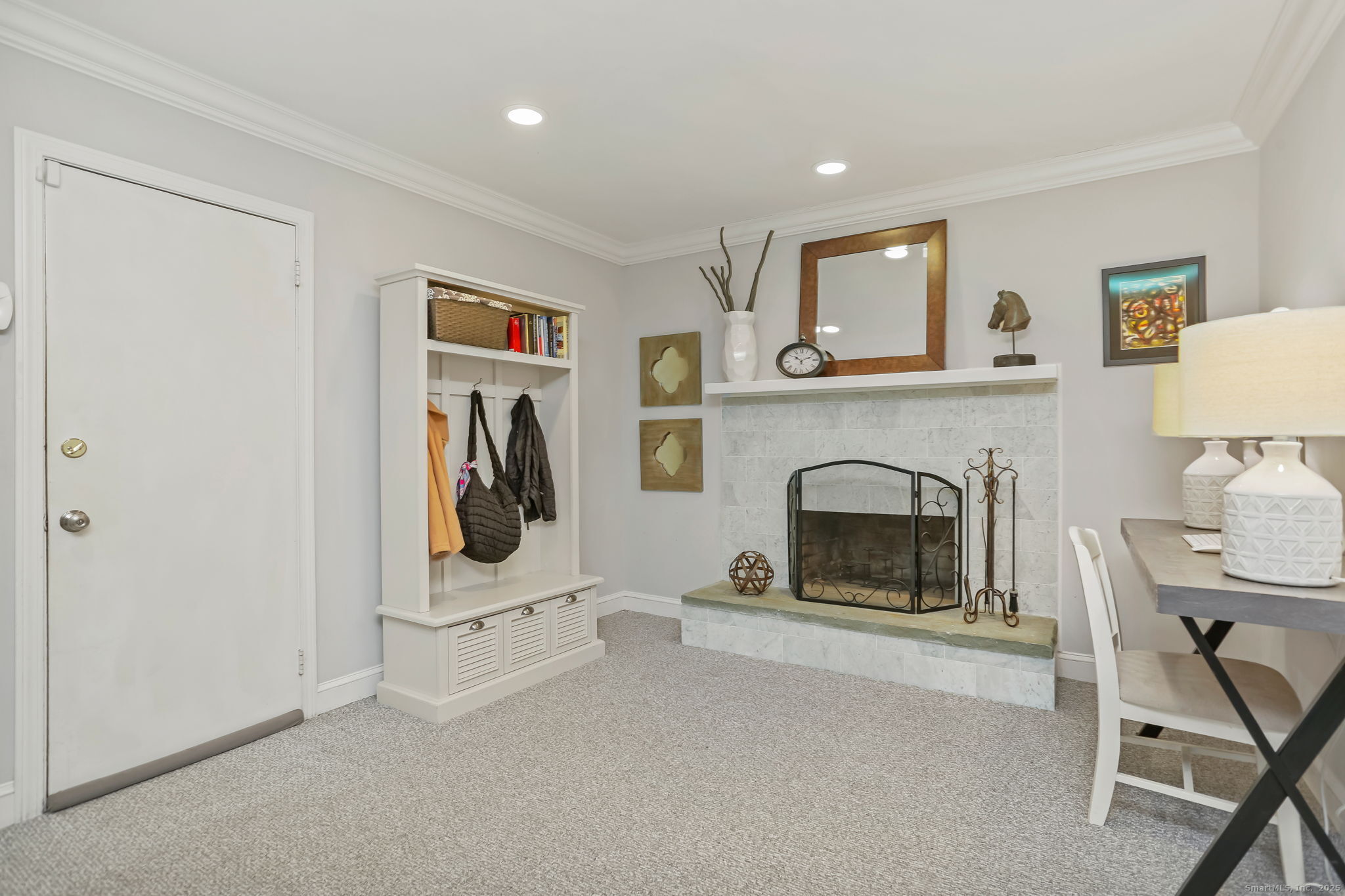 24 Warnock Drive Westport, CT 06880 - Photo 19 of 31 a living room with furniture and a fireplace