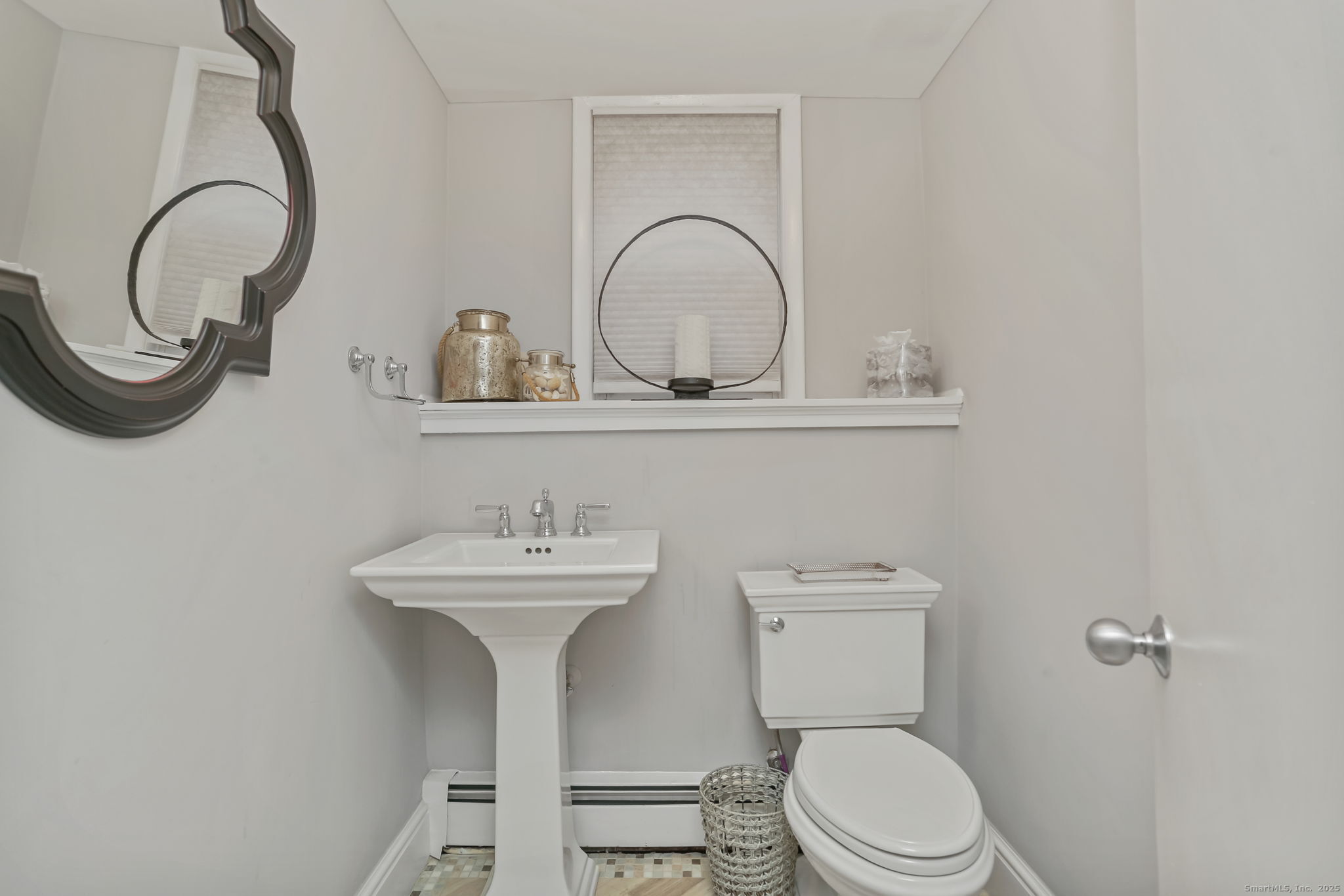 24 Warnock Drive Westport, CT 06880 - Photo 20 of 31 a bathroom with a toilet a sink and a mirror