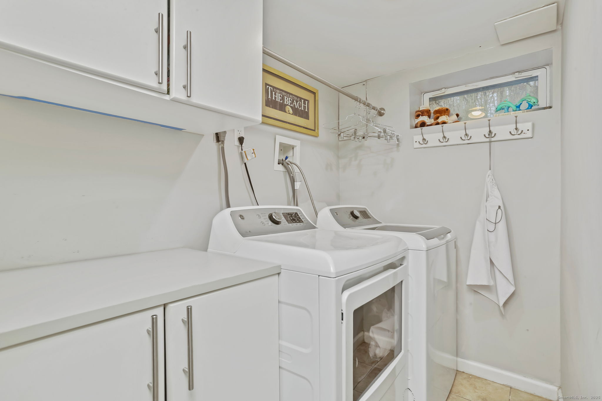 24 Warnock Drive Westport, CT 06880 - Photo 21 of 31 a utility room with dryer and washer