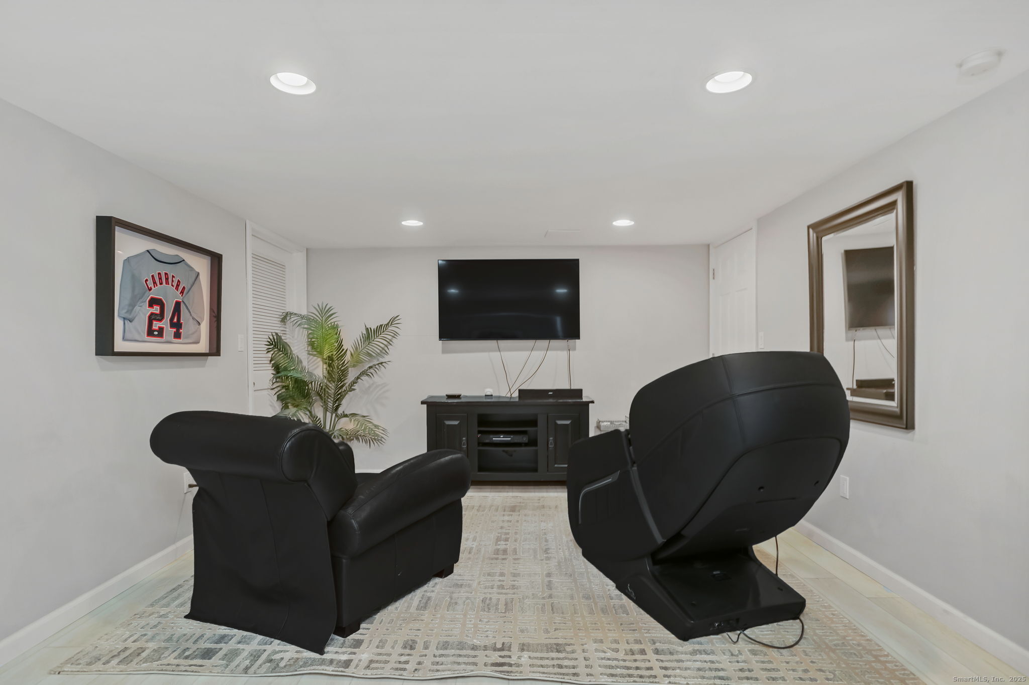 24 Warnock Drive Westport, CT 06880 - Photo 23 of 31 a living room with furniture and a flat screen tv