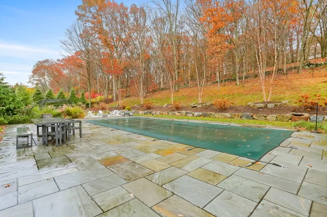 a view of swimming pool with chairs