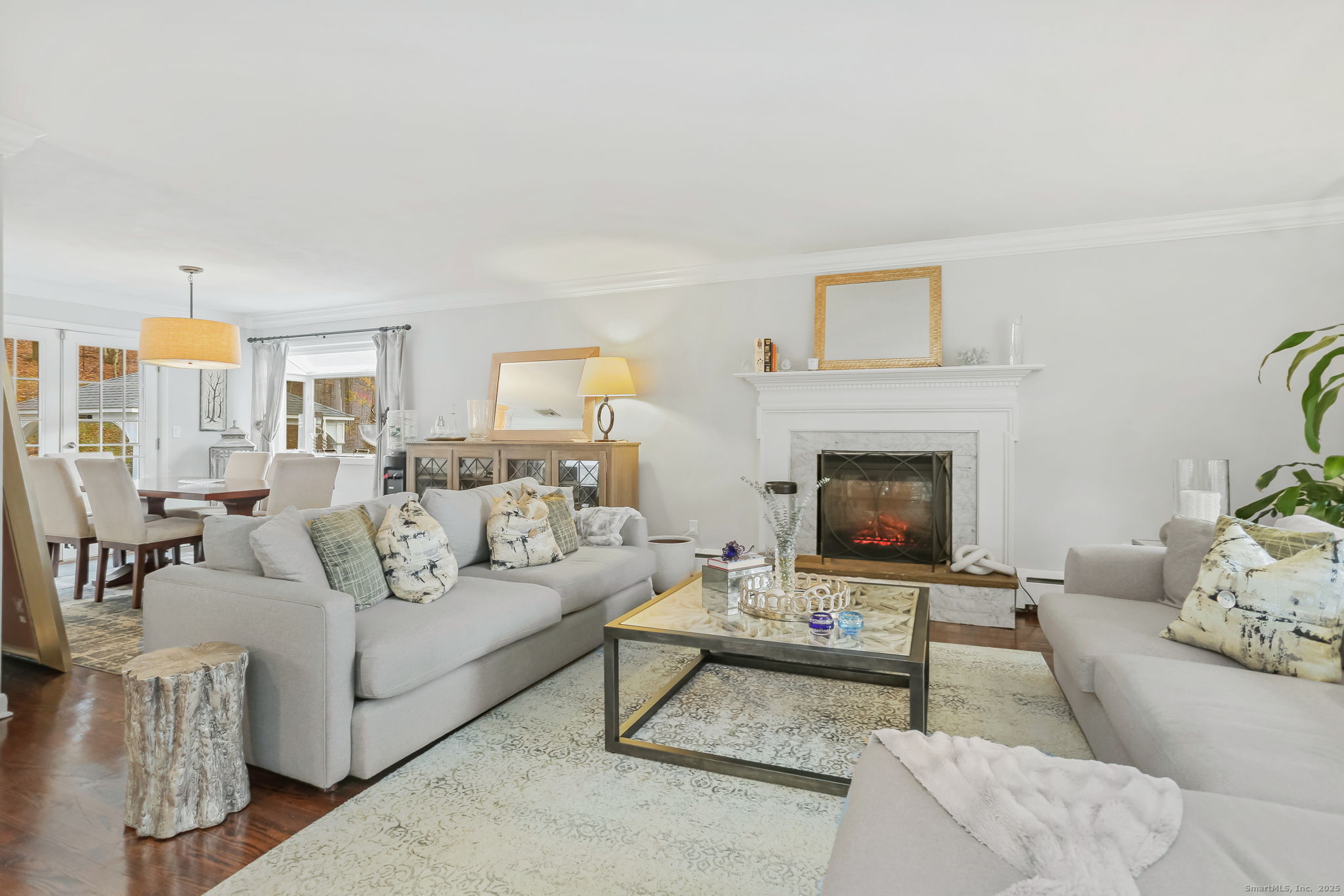 24 Warnock Drive Westport, CT 06880 - Photo 4 of 31 a living room with furniture a rug and a fireplace