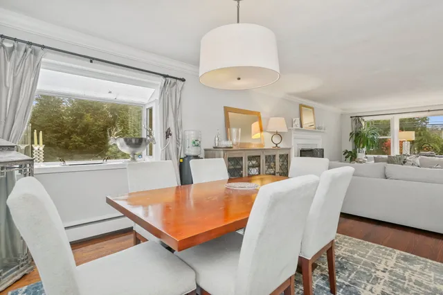 a bedroom with furniture and a flat screen tv