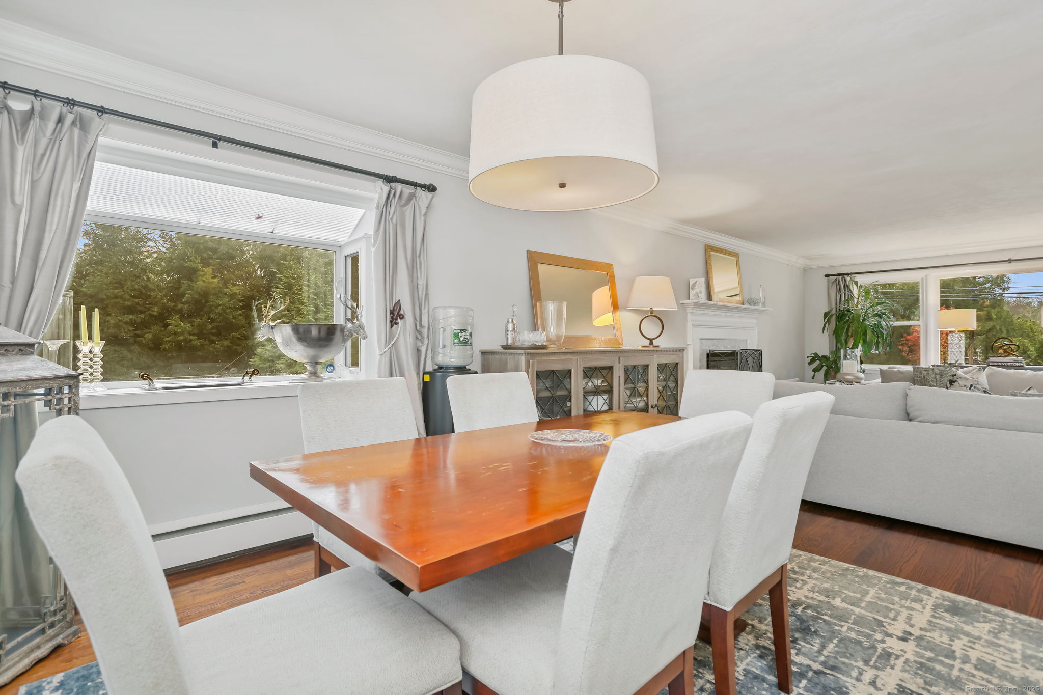 24 Warnock Drive Westport, CT 06880 - Photo 10 of 31 a living room with furniture a table and a large window