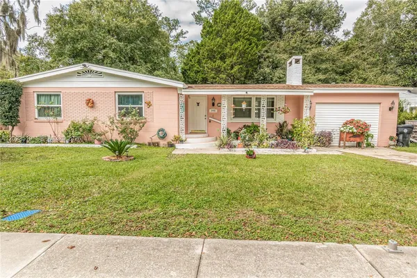 a front view of house with yard and seating space