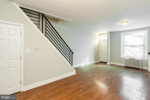 an entryway and an entryway with wooden floor